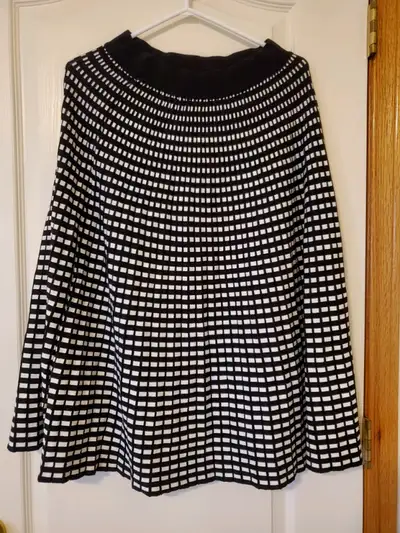 Black and white grid pattern knit skirt. Heavy and thick. Never worn. Pictures on seller's model. On...