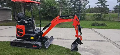 Premium machine, has to be seen to be understood, mini excavator with 11 attachments. 4000lbs machin...