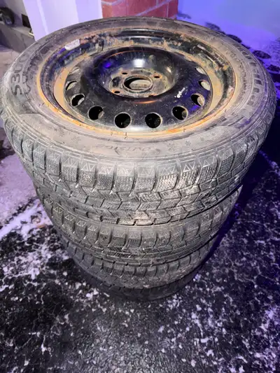 Offering a set of four rotalla S300 winter tires, size 185/60R15 87S, mounted on steel rims. Bolt pa...