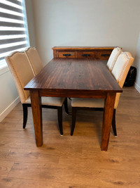Solid wood dining table with 4 chairs.