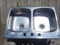 Used stainless steel double sink 31"x20 1/2".