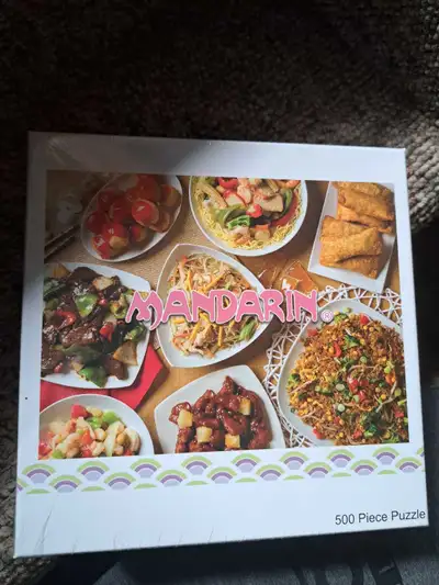 This is a new Mandarin Restaurant 500 piece puzzle, still in its original packaging. It would be a g...