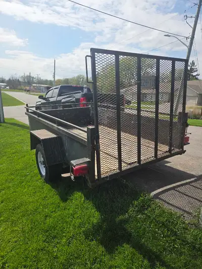 Every homeowner needs a trailer. This is an older Miska trailer but still solid. Wood planks are 2 y...