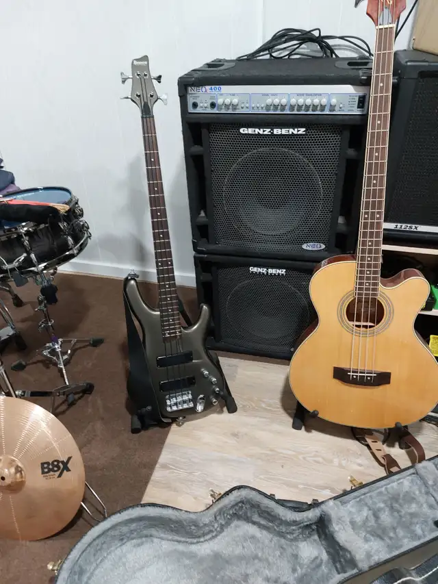 Two bass guitars and Bass amp