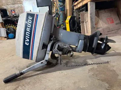 Here is a Evinrude 20 outboard motor, perfect for your boating needs. * Specifications: * Model: E20...