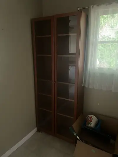 This is a used but sturdy wood bookshelf, perfect for any home or office. The shelves offer plenty o...