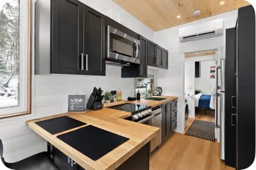 Tiny Home for single or couple! One bedroom, bathroom, kitchen, washer/dryer unit and a little seati...