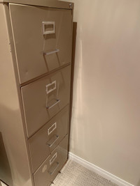 Four drawer legal sized metal filing cabinet.