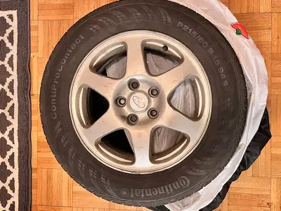 4 All seasons tires on rims. Only summer driven for 4 years on 2008 Hyundai Sonata Continental P215...