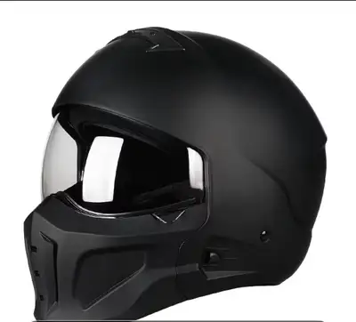 This sleek matte black motorcycle helmet features a modern modular design with a full-face aesthetic...