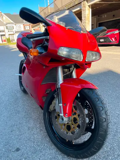 Testing the water. This 2001 Ducati 748 is a classic and thanks to its big brother (996) is apprecia...