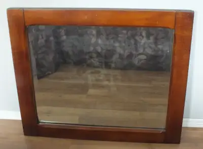 Antique Wood Framed Wall Mirror. It is made from a hardwood but not sure what type (Maple? Cherrywoo...