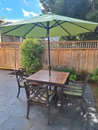 Patio table and 4 chairs with umbrella and cushions