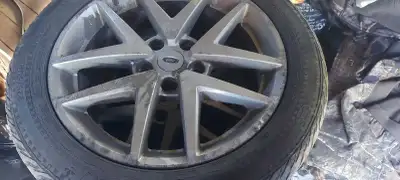 Selling a set of 2010 ford fusion rims (5×114.3) tires have lots of tread but are wether cracked but...