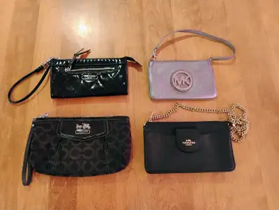 Coach and Michael Kors wristlets and small bags, View more