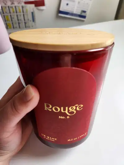 Enhance your living space with this UR-BANE Rouge No. 6 scented candle, boasting a generous 15.2 oz...