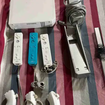 Nintendo Wii Console + Game and One white controller, View more