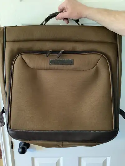 Canvas Eddie Bauer garment bag with leather trim. Would be great for the travelling business man for...
