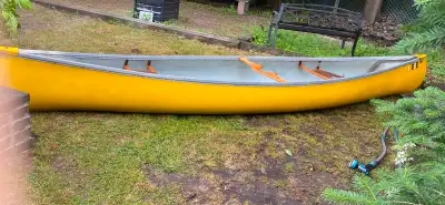 16’ foot two seater canoe with paddles(pictured). One seat is torn, replacements are available onlin...