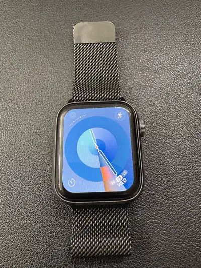 Gently used Apple Watch Series 5, 40mm space grey aluminum with a space black Milanese loop band for...