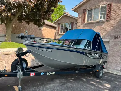 2008 Lowe FM175DC 96" Beam with a Mercury 90HP 2 Stroke motor with 4 blade spitfire propellor and el...