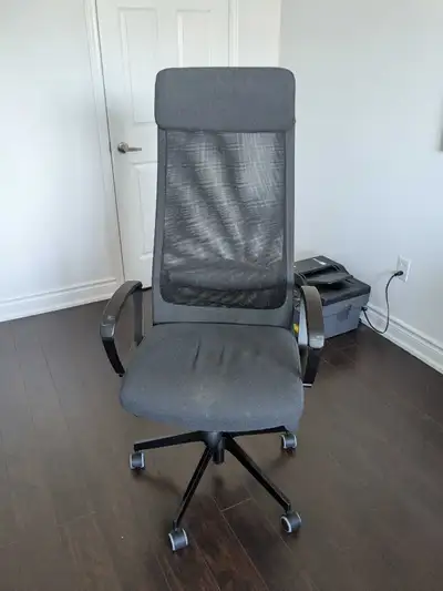 This is an IKEA Markus office chair, perfect for your home or office setup featuring a high back wit...