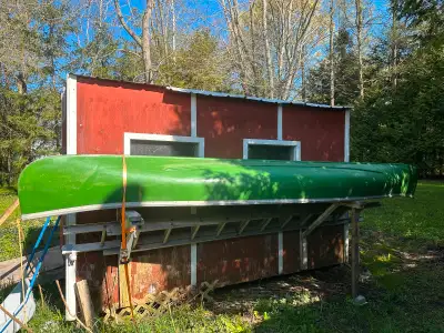 16’ fibreglass canoe had some repairs on both sides cracked and fibreglass