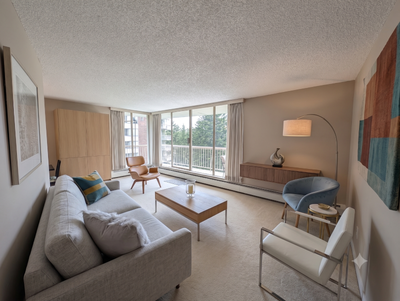 Skip the small, dark apartments and move into this beautifully large 2-bedroom suite 8th floor corne...