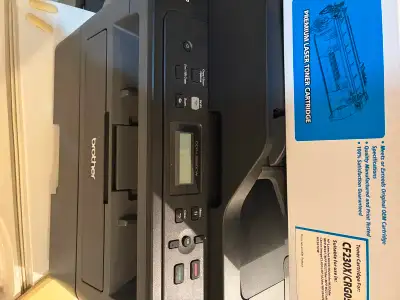 Used printer and new toner cartridge., View more