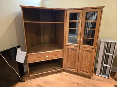 Drawer beneath tv shelf is stuck. Right side is for entertainment system. Located in basement. 57.5"...