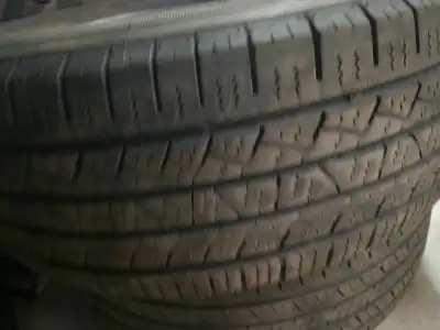 I am selling a pair of 235/65/17 all-season tires, perfect for cars or SUVs needing reliable perform...