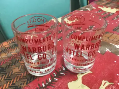 WARBURG, ALBERTA Two Matching Glasses Very Good Condition Printing is Bright Red Compliments of ….Wa...