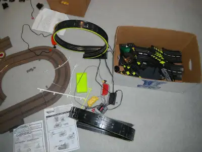 box full of playing car track set, View more