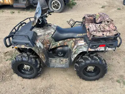 Windshield, winch, plow blade, cargo bag, LED light bar, gun scabbard, upgraded tires. Low miles, St...