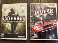 Two Nintendo Wii games, with books. $20 for the two.