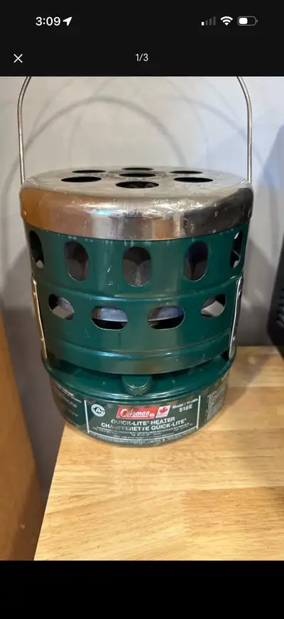 Vintage Coleman Model 518E Quick-Lite Heater, a portable catalytic heater designed for camping or em...