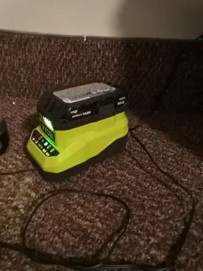Ryobi battery's x 4 plus Charger, View more