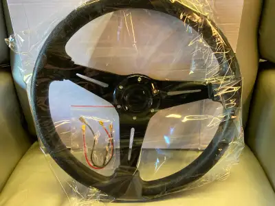 Brand new 14” black custom steering wheel, new in the box . Please contact