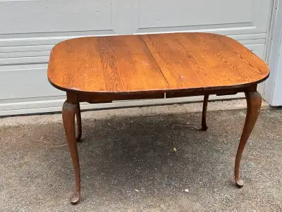 “Queen Anne Style Oak Dining Table” $65 Located near Berwick, NS. 49” long, 39.5” tall, 40” wide. No...