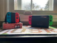 Nintendo switch + games,  2 dual controllers