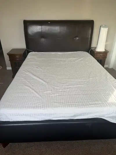 This is a queen-size storage bed frame, featuring a dark brown faux leather upholstery and a lift-up...