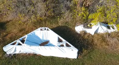 Truss Package for 24x40 building, with two dormers. Been tarped and sitting on pallets since new in...