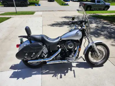 I was looking at the pictures of the bike, it looks like a dent or crease on the fuel tank. It is a...