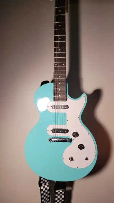 Light Blue Ephiphone Les Paul SL Guitar with mini Amp, View more