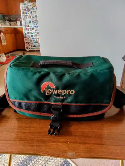 This is a Lowepro camera Bag that comes with all the dividers. The dividers have never been used. Ba...