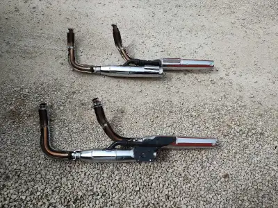 2 separate exhaust pipes; 1 with all brackets, 1 without. Fits a range of Honda 750 V-twin engine ye...