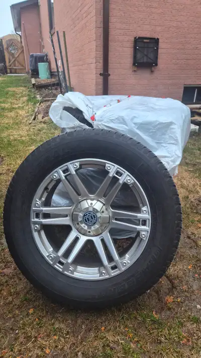 Set of 4 RSSW Krawler Hyper Silver alloy rims with General Grabber tires Removed from a 2018 Ram 150...