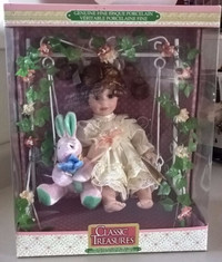 Classic Treasures Bisque Porcelain Doll on Swing