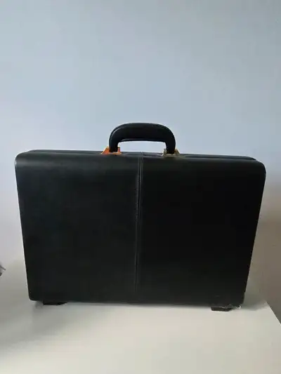Slim executive leather document carrying attache case. Rare side (rather than top/front) locks. Neve...