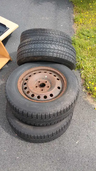 I'm selling a set of four steel rims that conveniently come with tires included. The rims show some...